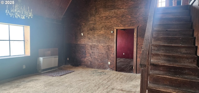 carpeted empty room with stairs