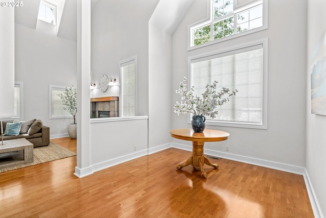 465 Covey Ln, Eugene, OR 97401 - foyer featuring a high ceiling, wood finished floors, a tile fireplace, and baseboards