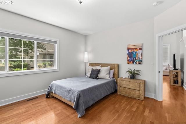 465 Covey Ln, Eugene, OR 97401 - bedroom featuring wood finished floors and baseboards