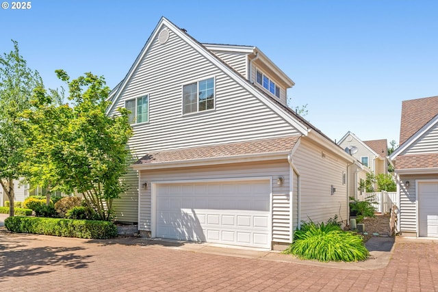 465 Covey Ln, Eugene, OR 97401 - view of front of home featuring decorative driveway and a garage