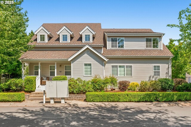 465 Covey Ln, Eugene, OR 97401 - view of front facade with a shingled roof and a porch