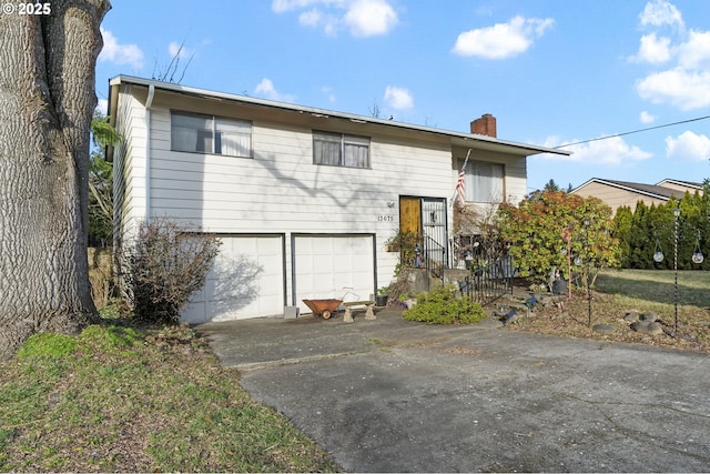 split foyer home featuring a garage