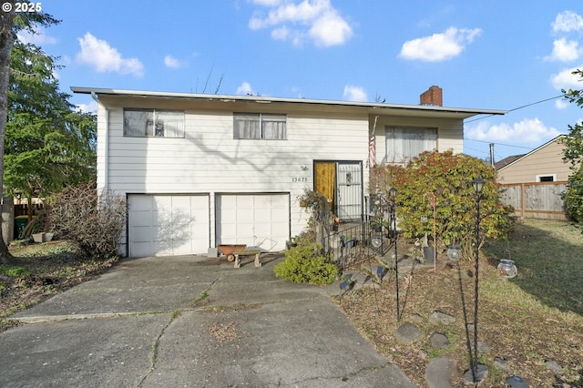 split foyer home featuring a garage