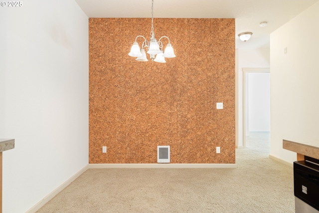 11830 NW Holly Springs Ln Unit 406, Portland, OR 97229 - unfurnished room with a chandelier, a smoke detector, and carpet