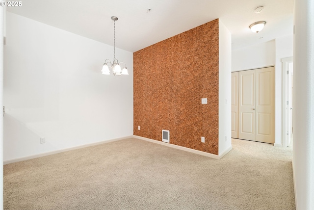 11830 NW Holly Springs Ln Unit 406, Portland, OR 97229 - unfurnished room with a chandelier, carpet flooring, and a smoke detector
