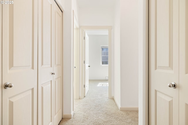 11830 NW Holly Springs Ln Unit 406, Portland, OR 97229 - hallway with light carpet and baseboards