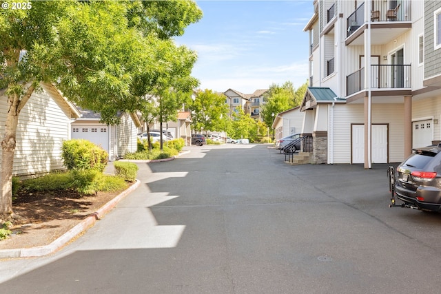 11830 NW Holly Springs Ln Unit 406, Portland, OR 97229 - view of asphalt street featuring a residential view and curbs