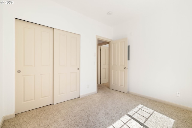 11830 NW Holly Springs Ln Unit 406, Portland, OR 97229 - unfurnished bedroom featuring a closet and carpet
