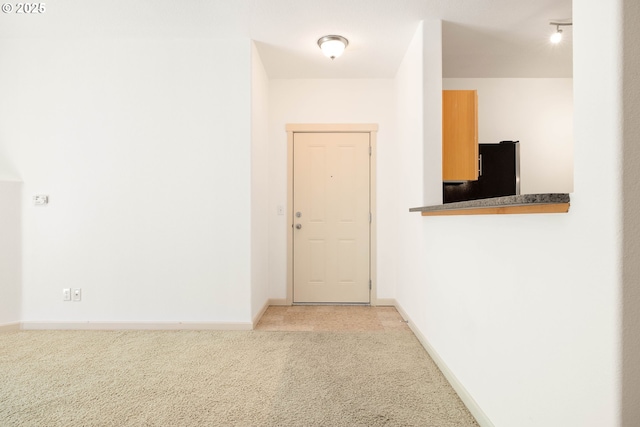11830 NW Holly Springs Ln Unit 406, Portland, OR 97229 - hallway with light carpet and baseboards