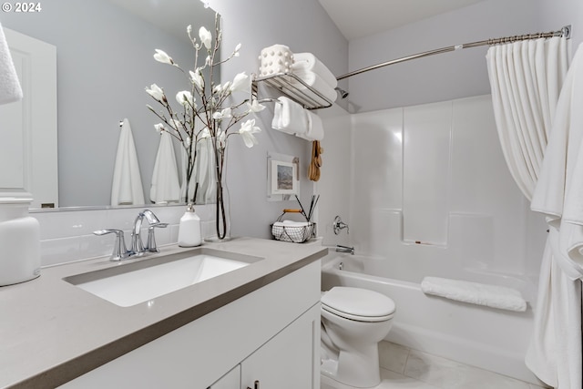 full bathroom featuring toilet, vanity, and shower / tub combo with curtain
