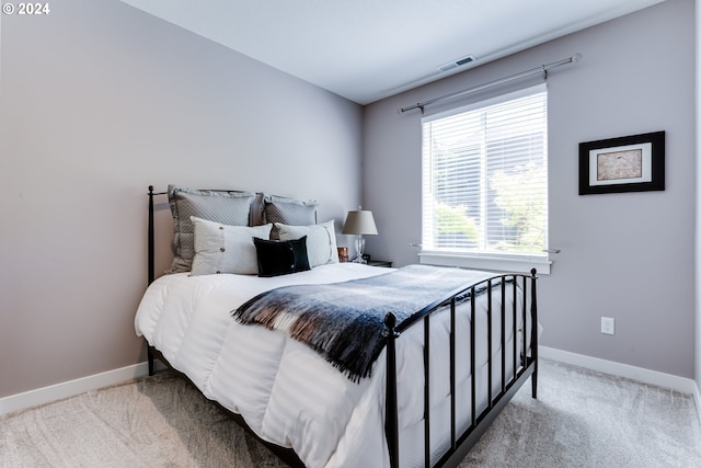 bedroom featuring carpet floors and baseboards