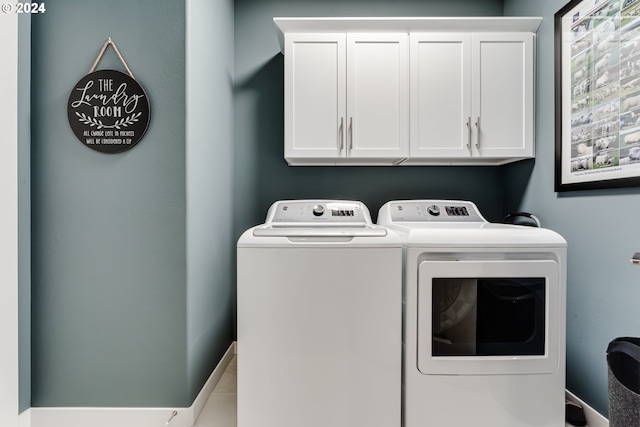 washroom with independent washer and dryer and cabinet space