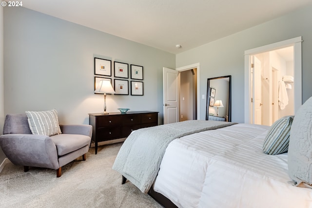 bedroom featuring light carpet