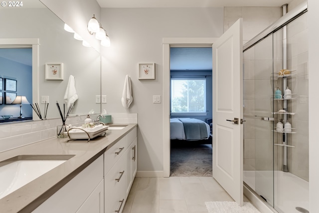 bathroom featuring connected bathroom, a shower stall, double vanity, and tile patterned floors