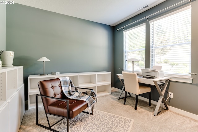 carpeted office space with baseboards