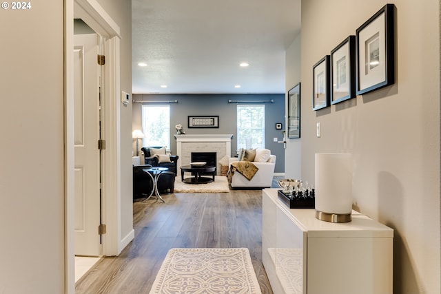 hallway with wood finished floors and recessed lighting