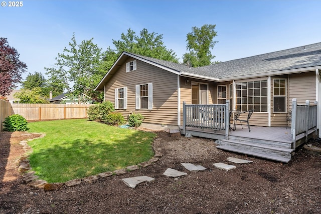 back of house with a wooden deck and roof with shingles