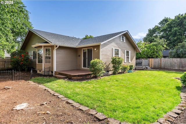 rear view of house with a wooden deck, roof with shingles, and crawl space