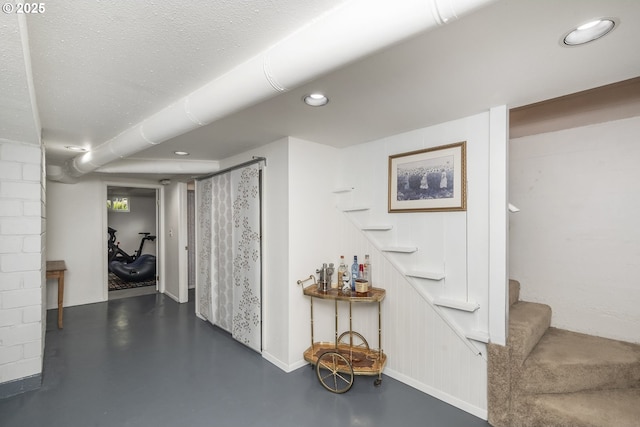 2535 N Baldwin St, Portland, OR 97217 - corridor with finished concrete flooring, stairs, and recessed lighting