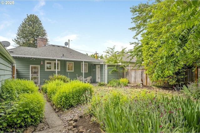 2535 N Baldwin St, Portland, OR 97217 - back of property with a chimney and roof with shingles