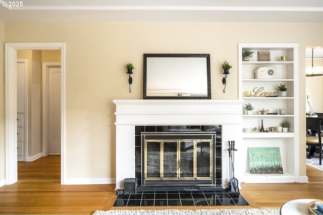 2535 N Baldwin St, Portland, OR 97217 - detailed view of wood finished floors, a fireplace, and built in features