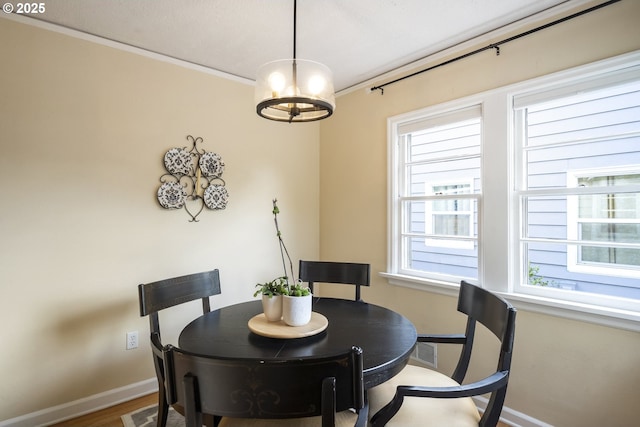 2535 N Baldwin St, Portland, OR 97217 - dining area with ornamental molding, a chandelier, and wood finished floors