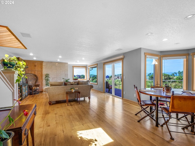 89610 Sea Breeze Dr, Warrenton, OR 97146 - dining area featuring light wood finished floors, a textured ceiling, and recessed lighting