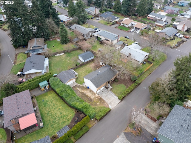 birds eye view of property with a residential view