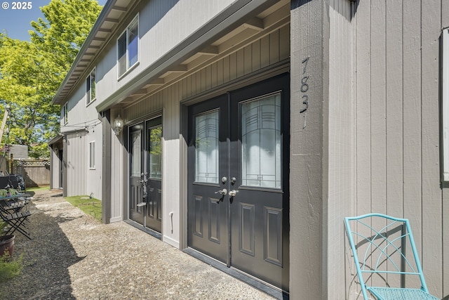 7831 SW 34th Ave, Portland, OR 97219 - property entrance with fence and french doors