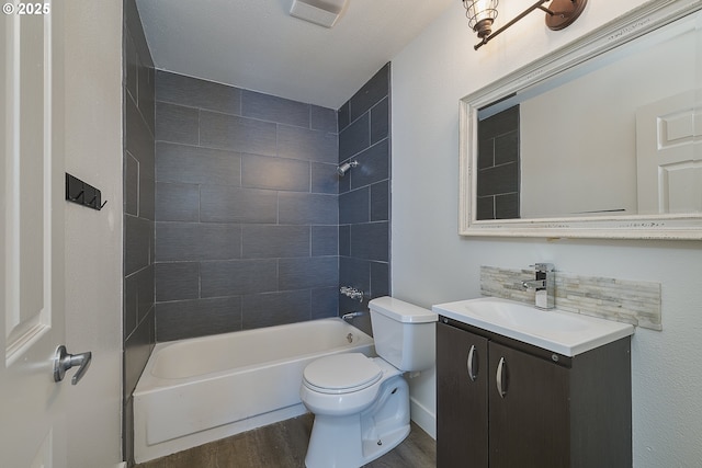 7831 SW 34th Ave, Portland, OR 97219 - full bathroom featuring toilet, vanity, shower / bathing tub combination, and wood finished floors