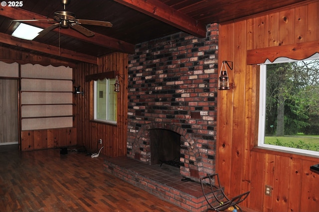 61021 Landreth Ln, Saint Helens, OR 97051 - unfurnished living room with a wood ceiling with exposed beams, plenty of natural light, wood walls, ceiling fan, and wood finished floors