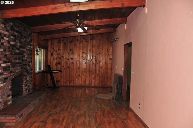 61021 Landreth Ln, Saint Helens, OR 97051 - unfurnished living room featuring radiator heating unit, wood finished floors, a wooden ceiling with exposed beams, wood walls, and ceiling fan