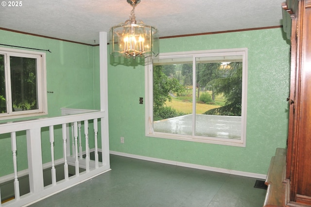 61021 Landreth Ln, Saint Helens, OR 97051 - empty room with crown molding, a textured ceiling, a chandelier, tile patterned floors, and a textured wall