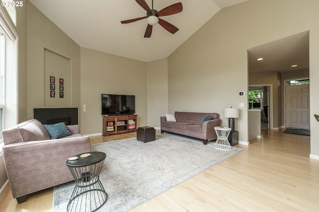 1216 SE 47th St, Hillsboro, OR 97123 - living area featuring a ceiling fan, wood finished floors, high vaulted ceiling, and baseboards