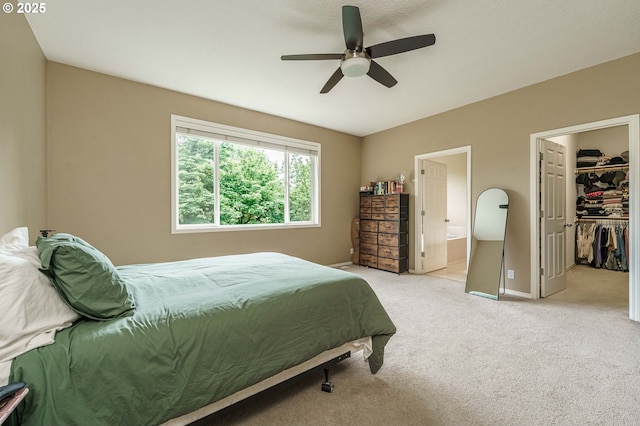 1216 SE 47th St, Hillsboro, OR 97123 - carpeted bedroom featuring a spacious closet, baseboards, ensuite bathroom, a ceiling fan, and a closet
