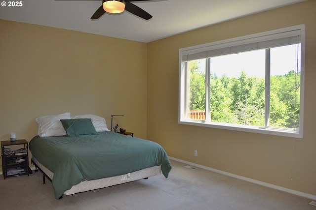 1216 SE 47th St, Hillsboro, OR 97123 - carpeted bedroom featuring multiple windows, baseboards, and ceiling fan