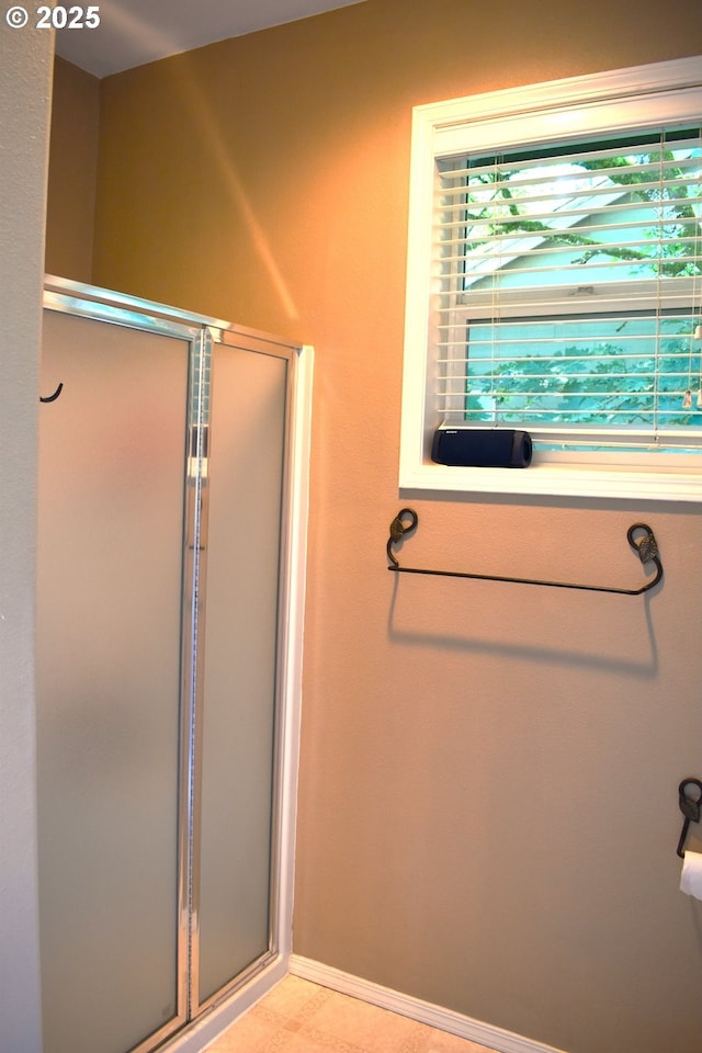 1216 SE 47th St, Hillsboro, OR 97123 - bathroom featuring a shower stall and baseboards