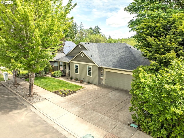 1216 SE 47th St, Hillsboro, OR 97123 - view of front of home featuring concrete driveway, roof with shingles, an attached garage, and a front yard