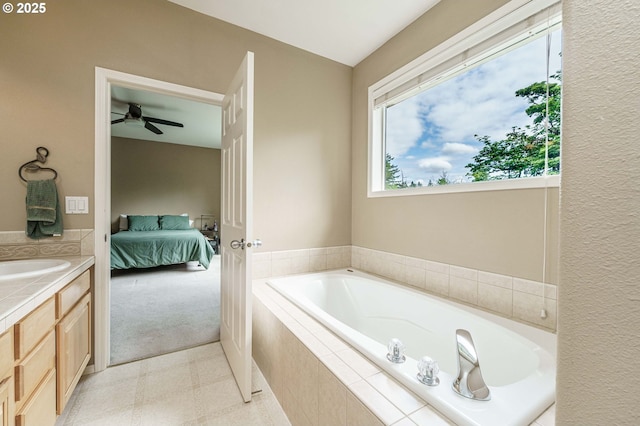 1216 SE 47th St, Hillsboro, OR 97123 - bathroom with ensuite bath, a bath, vanity, tile patterned floors, and ceiling fan