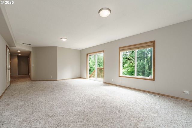 1216 SE 47th St, Hillsboro, OR 97123 - empty room featuring carpet floors and baseboards