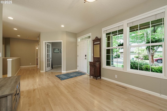 1216 SE 47th St, Hillsboro, OR 97123 - foyer featuring light wood-style flooring, baseboards, and recessed lighting