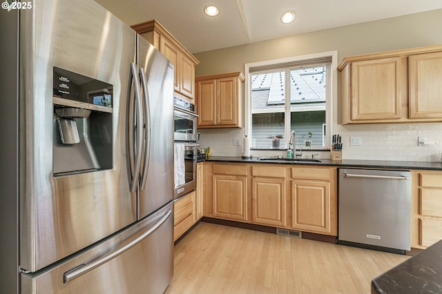 1216 SE 47th St, Hillsboro, OR 97123 - kitchen with appliances with stainless steel finishes, a sink, light brown cabinets, tasteful backsplash, and recessed lighting
