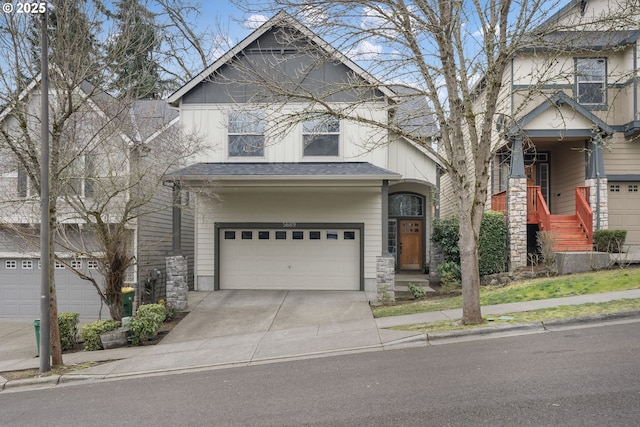 view of front of property featuring driveway, an attached garage, and a shingled roof