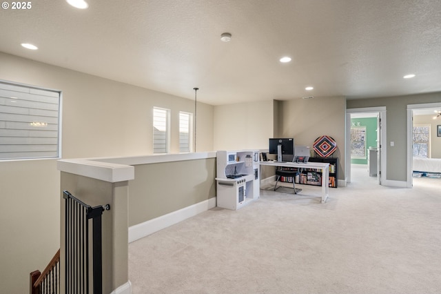 carpeted living room with recessed lighting, baseboards, and a textured ceiling