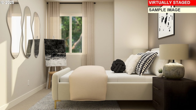 bedroom featuring carpet and baseboards