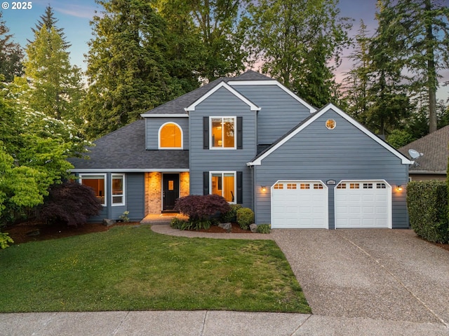 8967 SW Leslie St, Portland, OR 97223 - traditional home featuring a garage, driveway, a front lawn, and roof with shingles