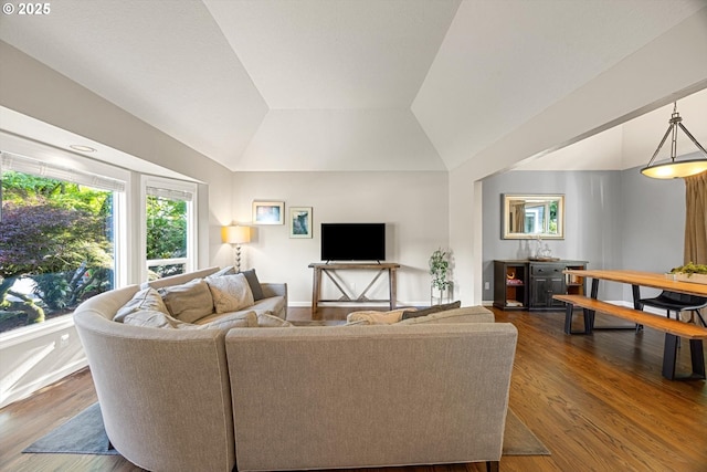 8967 SW Leslie St, Portland, OR 97223 - living room featuring dark wood-type flooring, lofted ceiling, and baseboards