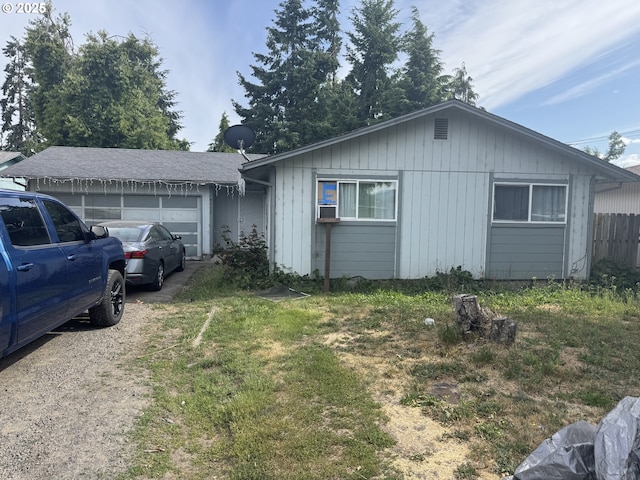 5111 D St, Springfield, OR 97478 - view of front of house with an attached garage and board and batten siding