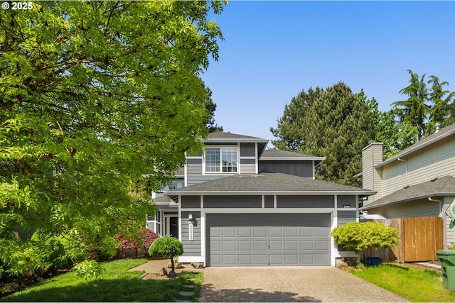 view of front of home featuring an attached garage, a shingled roof, fence, and concrete driveway