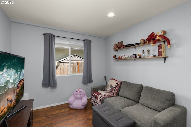 living area with baseboards, recessed lighting, and wood finished floors